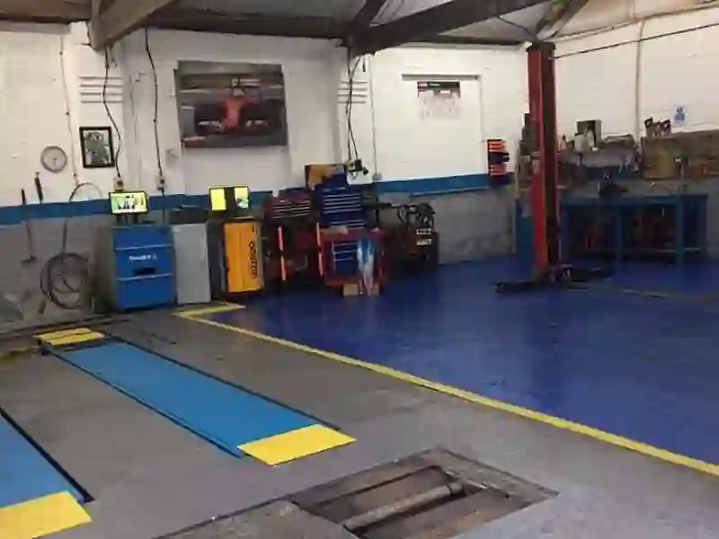 Inside the M&A MOT workshop in Rochdale — the MOT bay and vehicle lift