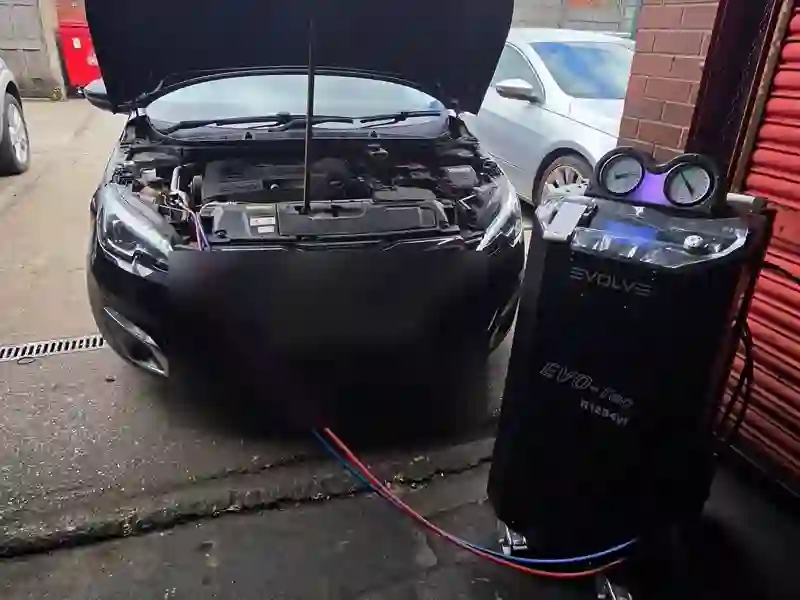 A car having an air-con service outside the M&A MOT unit in Rochdale